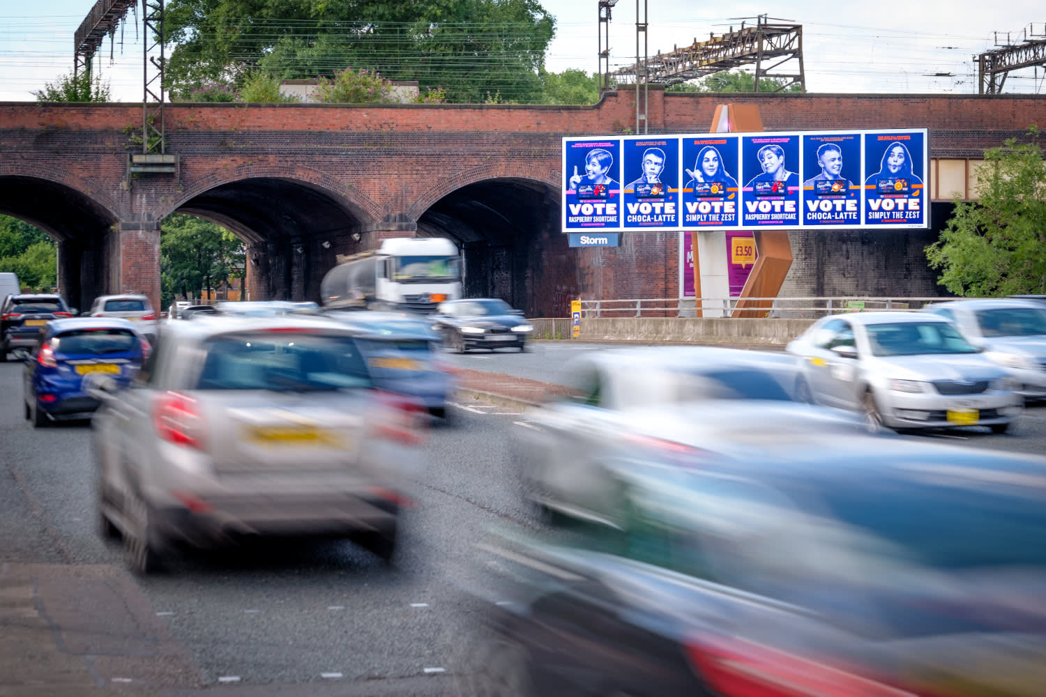 Clear channel Storm site on a busy road showing Mondelez ad