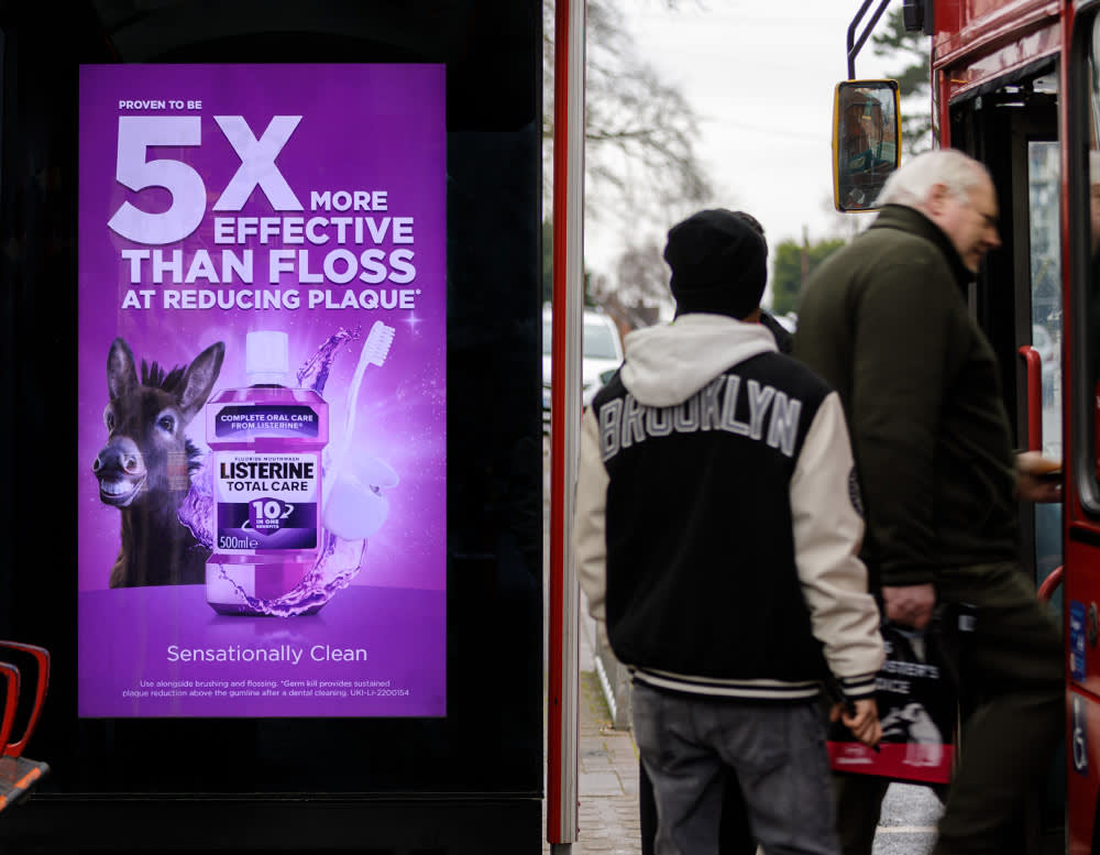 Mouthwash brand advertised on a digital bus shelter poster