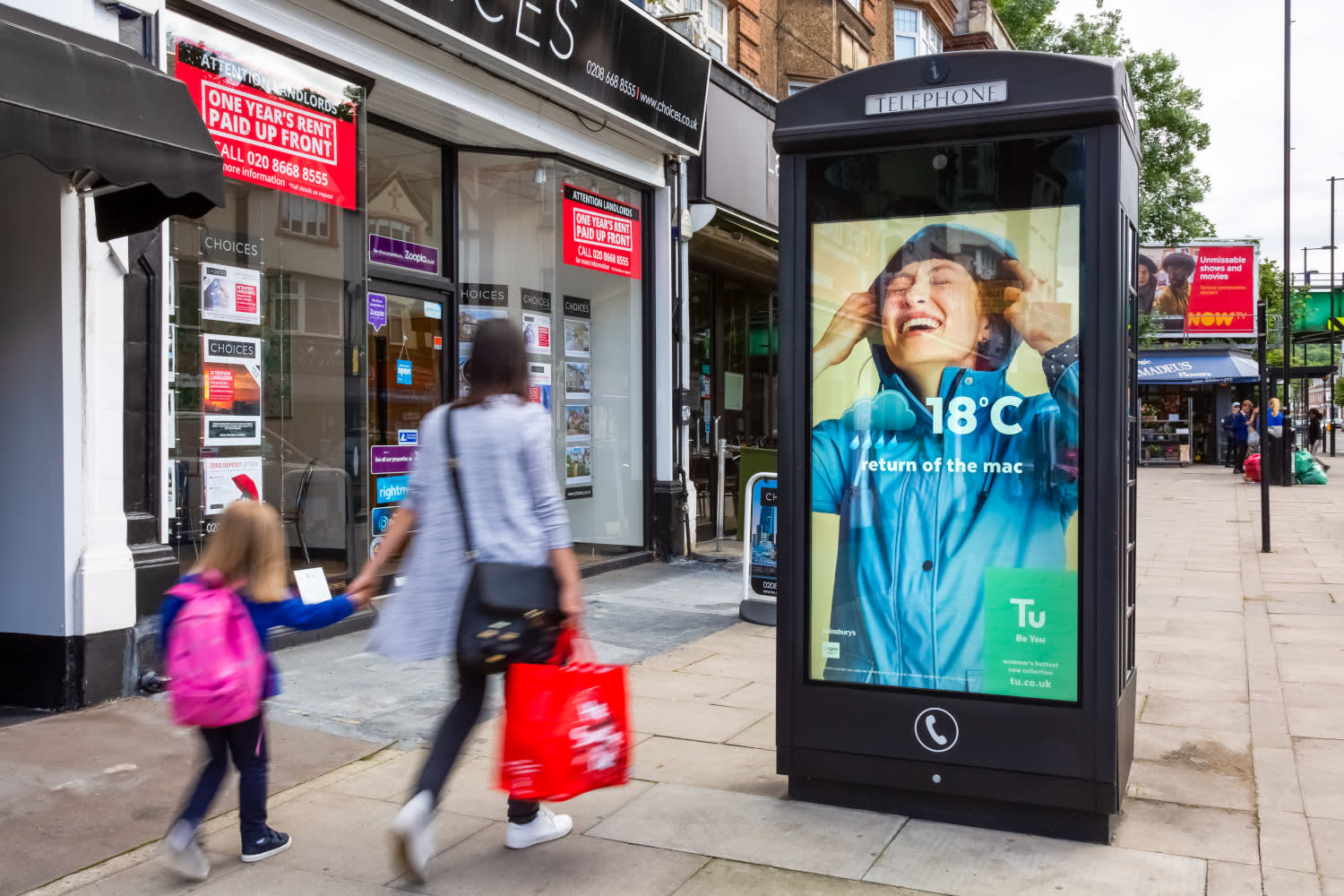 Digital phone box screen showing Tu ad