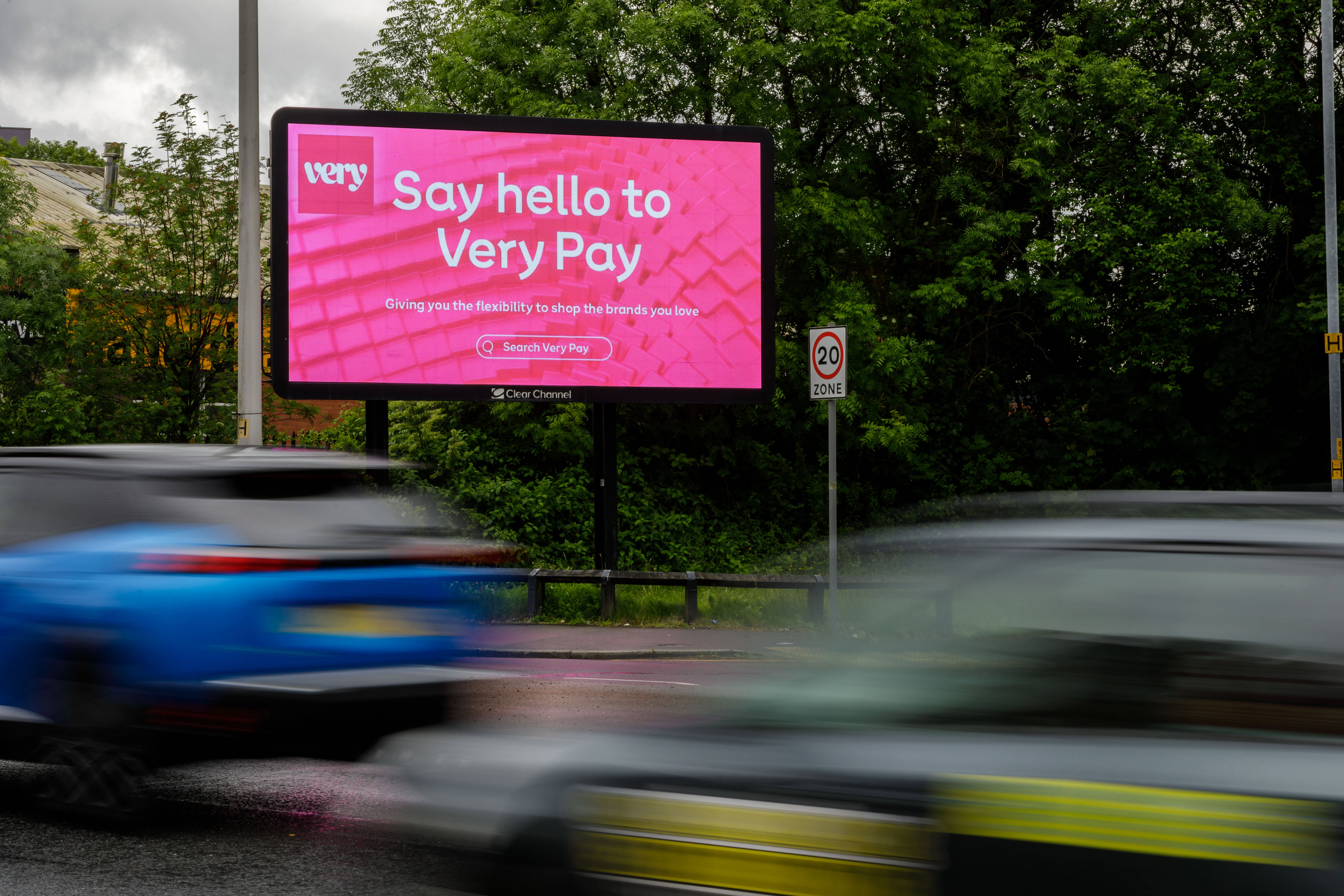 Clear Channel Digital billboard on a busy road showing ad for Very