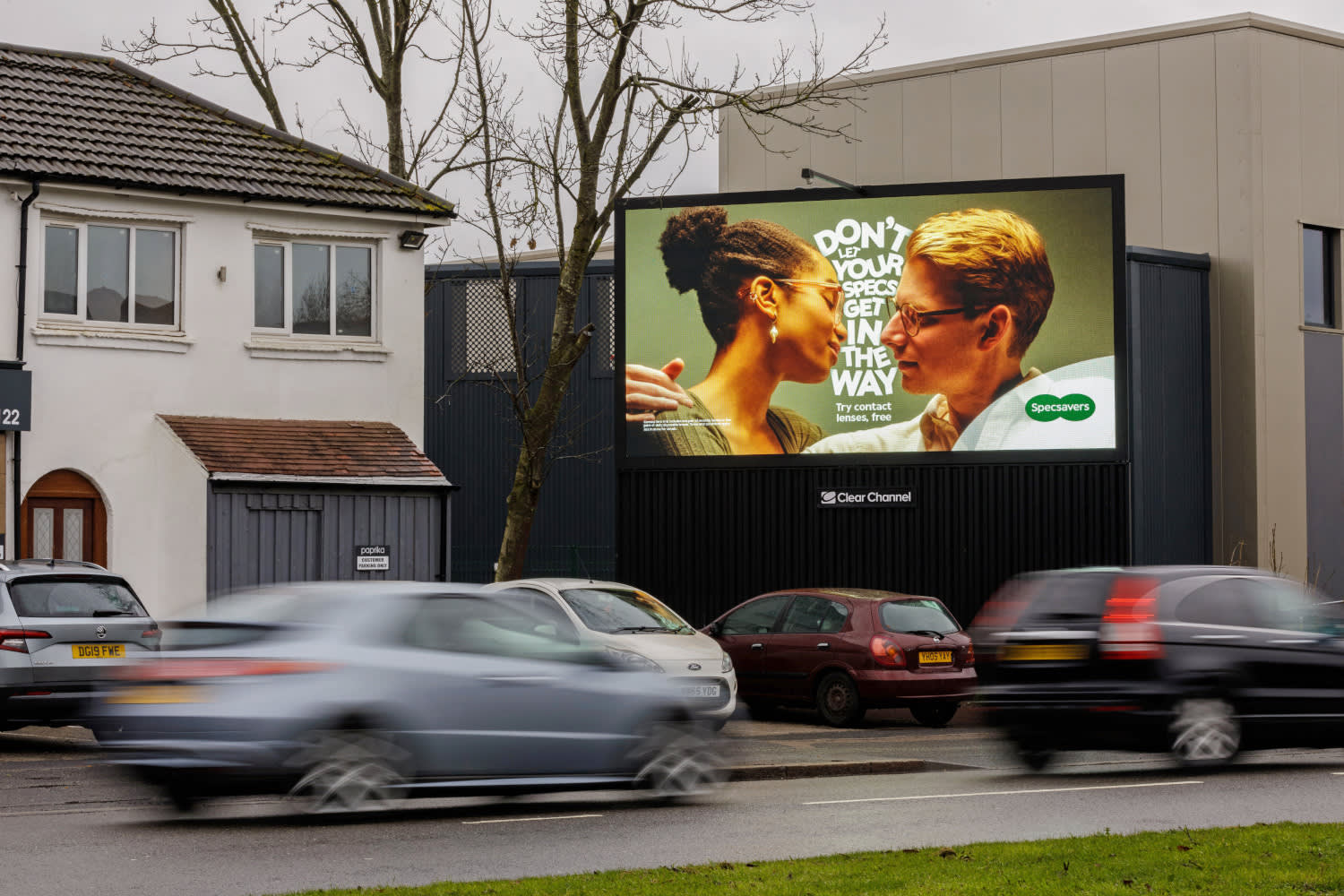 Large billboard showing ad for Specsavers