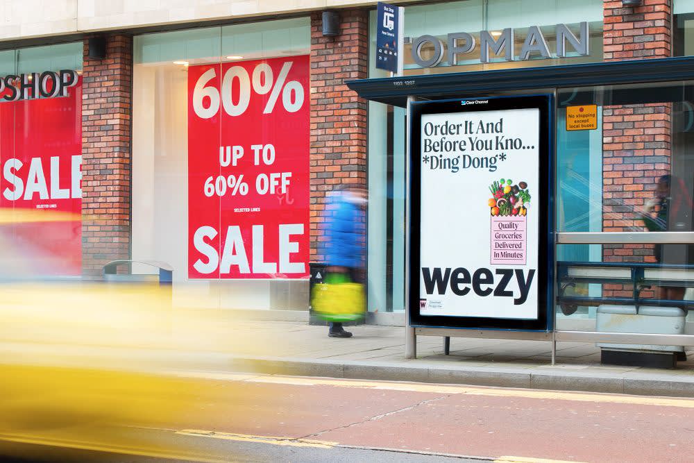 Bus stop outside Topman showing Weezy ad