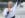 Charlotte raises a fist in celebration in her canoe in Tokyo