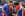 three cyclists celebrating together with union flags