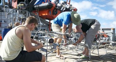 Dr Tom Letessier, Dr Bob Long and Professor Jessica Meeuwig preparing the BRUVS
. Credit: David Tickler, UWA