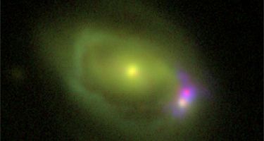 The Was 49 system, which consists of a large disk galaxy.
. Credit: DCT/NRL