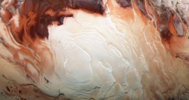 …The icy cap that covers the south pole is composed of frozen water and carbon dioxide
. Credit: ESA/DLR/FU Berlin / Bill Dunford