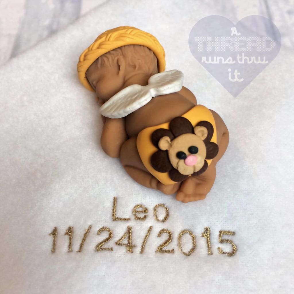 Angel baby keepsake with lion on diaper #athredrunsthruit
