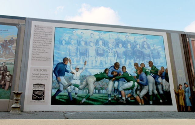 Мурал «Iron Man Game» Роберта Даффорда, созданный в 1994 г. в рамках Floodwall Mural Project – проекта об истории города Портсмута. Фото: Scioto Historical Series