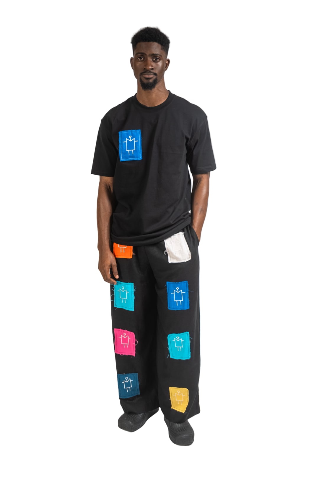 Buy Black linen trousers with monogram patch detail by The Kowa Studio