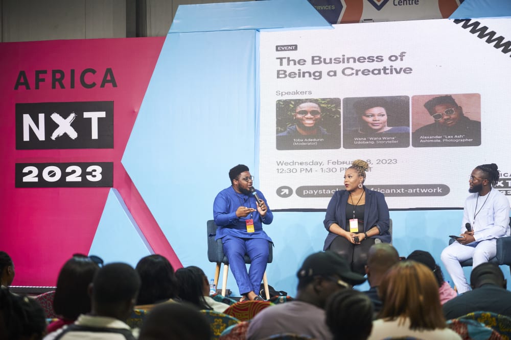 Paystack’s Media Associate - Toba Adedurin listening to a fellow panelist during a panel conversation about “The Business of Being a Creative” during the 2023 Africa NXT Conference in Lagos, Nigeria.