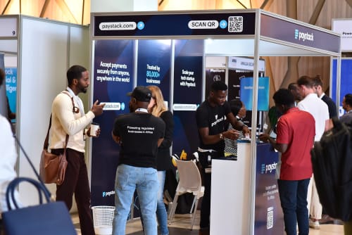 Stacks speaking to attendees at a Paystack Booth during the African Tech Summit in Kenya.