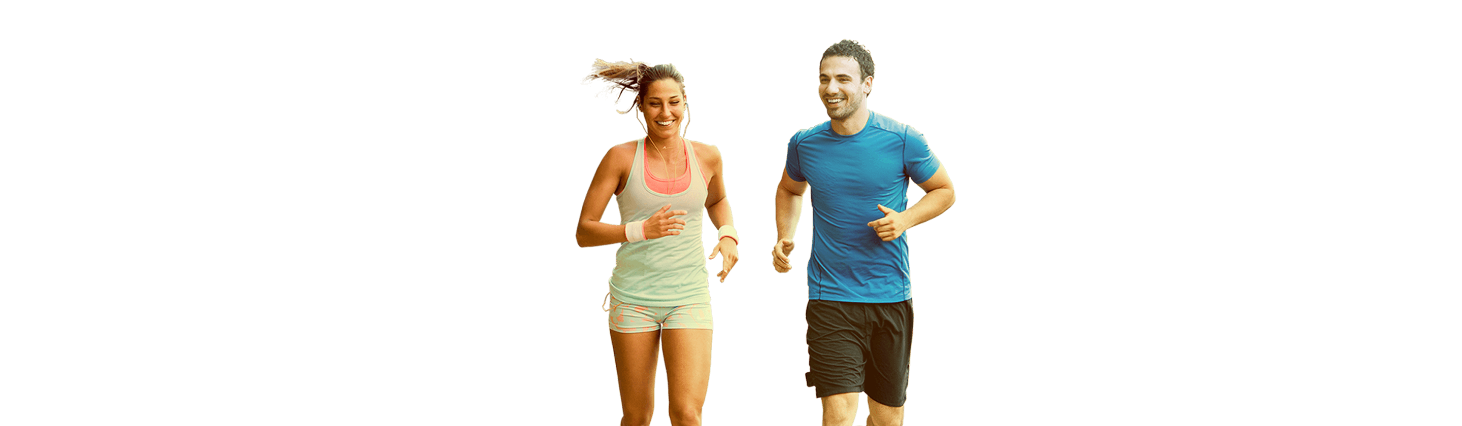 A young man and a girl in sportswear run in the park.