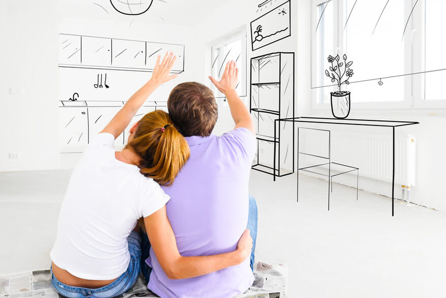 A young couple in an embrace looks into a drawn kitchen.