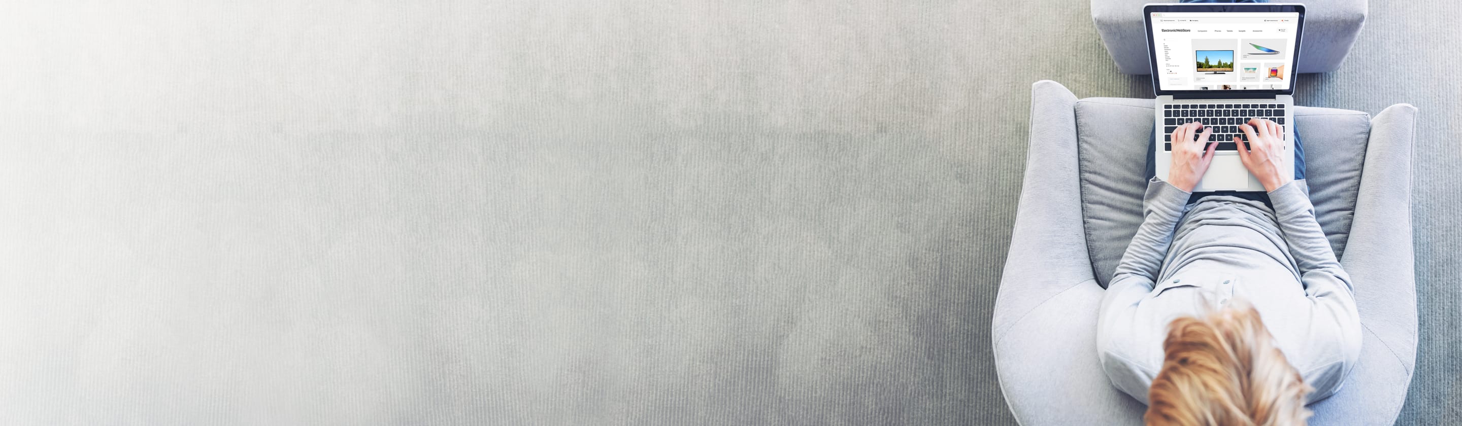 Woman on couch with laptop.