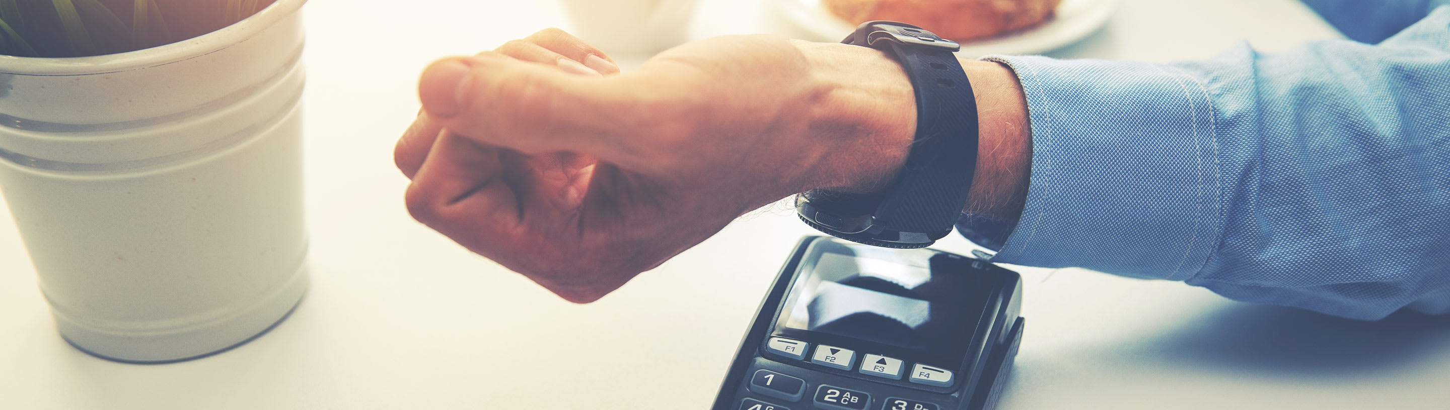 Apple smart watch leaning against the POS device.