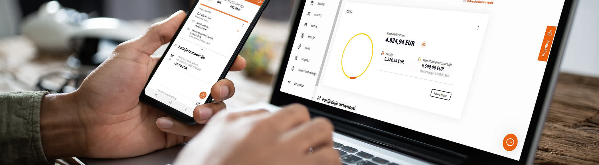 Mobile phone and laptop with online banking balance screens.