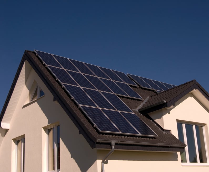 Roof of residential house with installed solar panels.