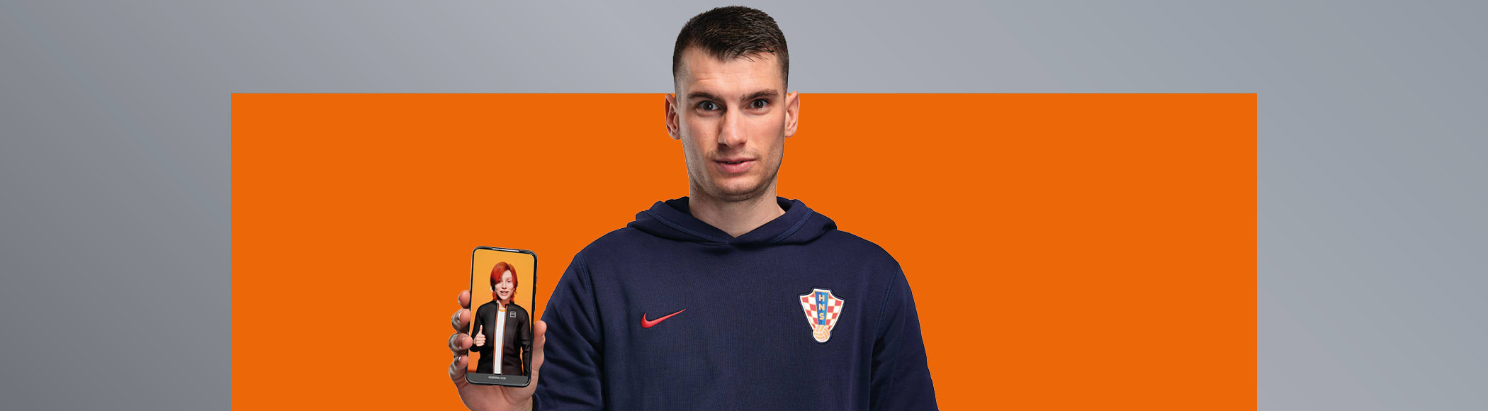 Livaković with a mobile phone in his hand.
