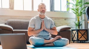 mature man doing yoga