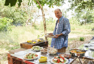 man cooking outside