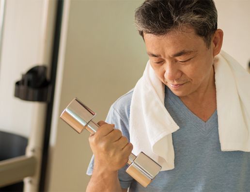 Asian man lifting weight