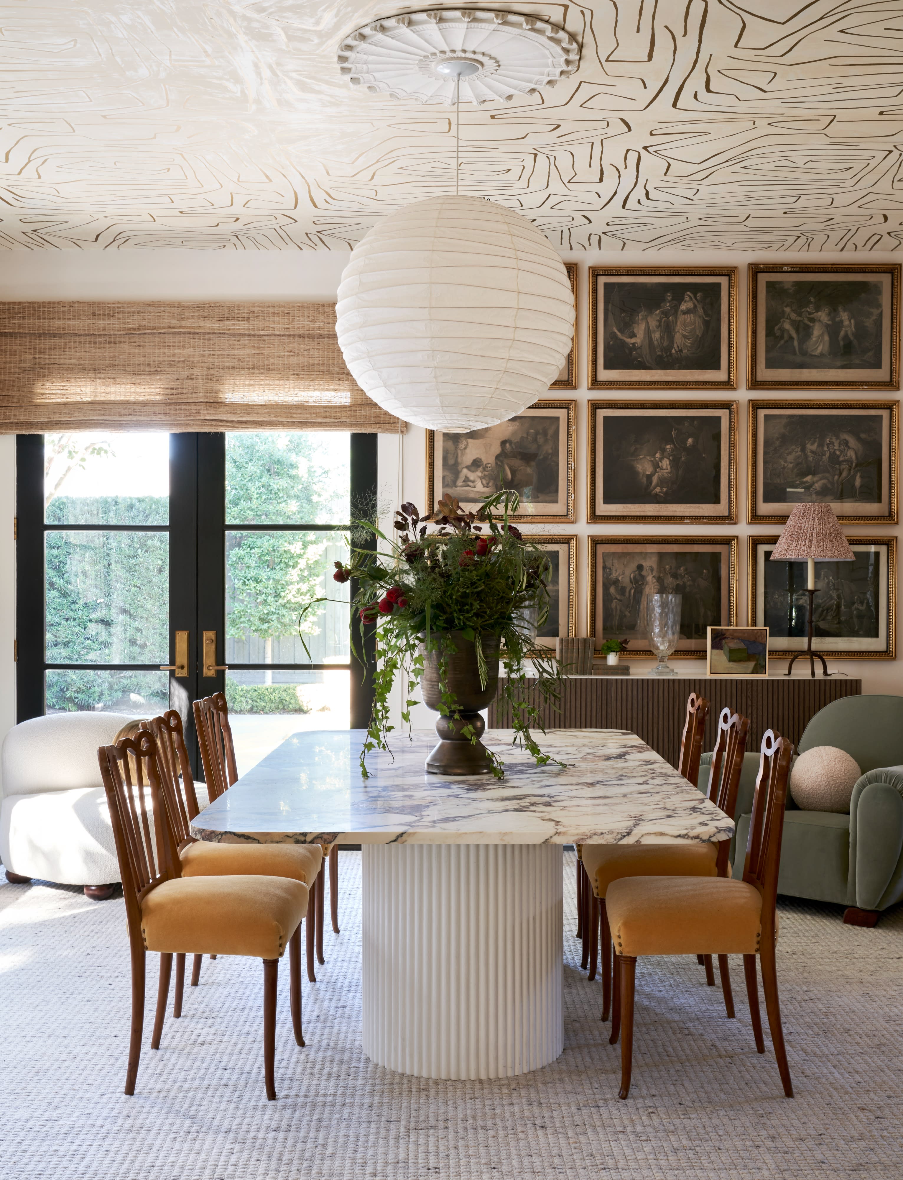 The outdoor dining area features elegantly set tables with autumn decorations, ready for a dinner gathering.