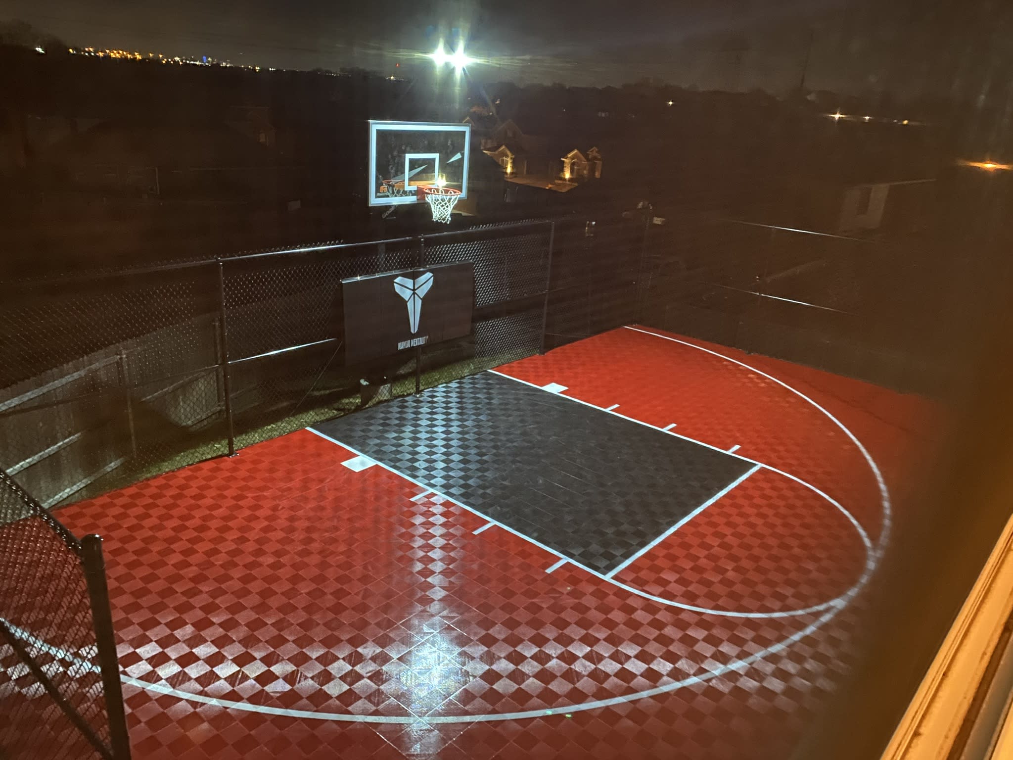 outdoor basketball court at night