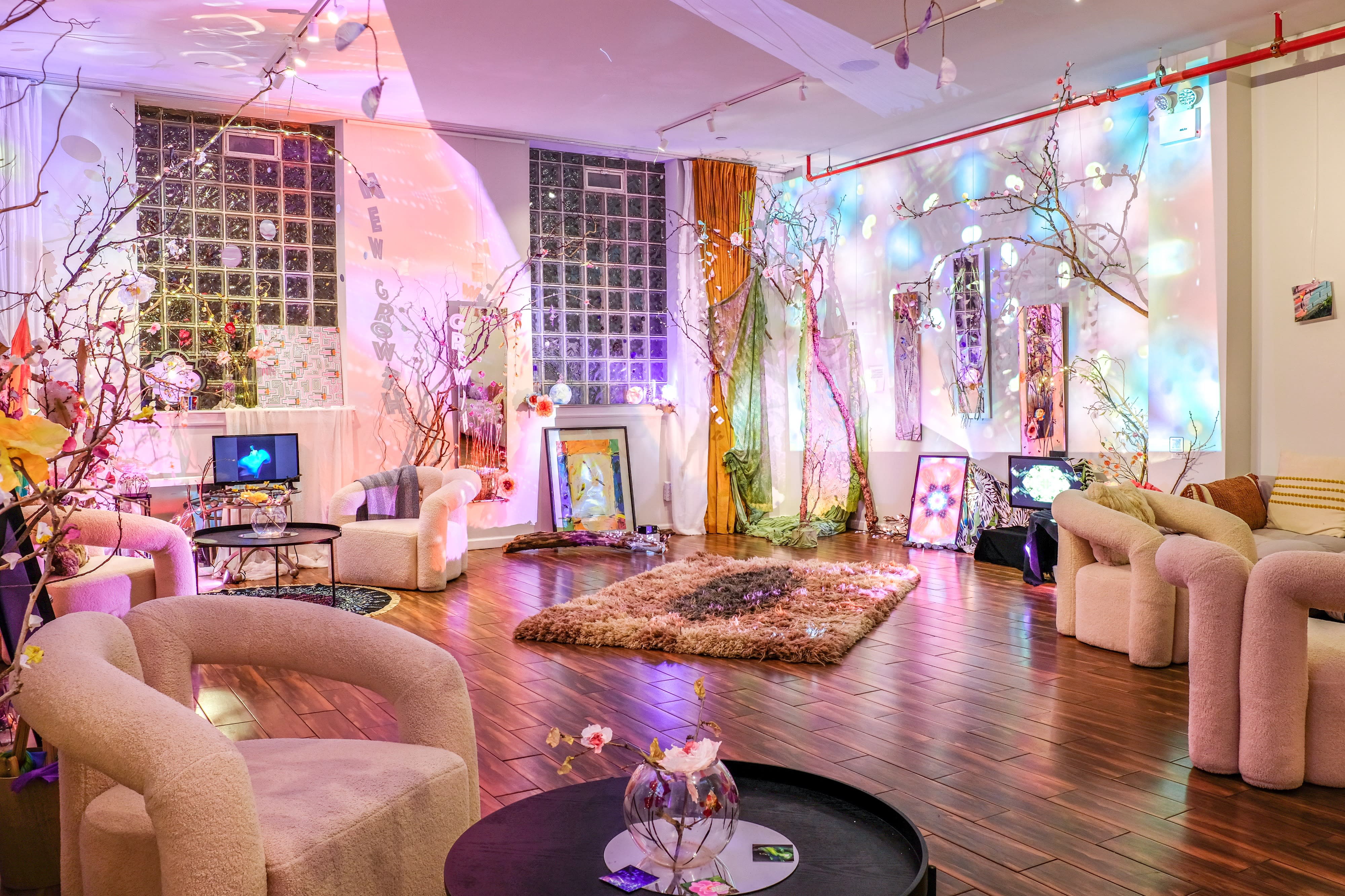 The room is decorated with colorful streamers and lights, setting the scene for a birthday celebration.