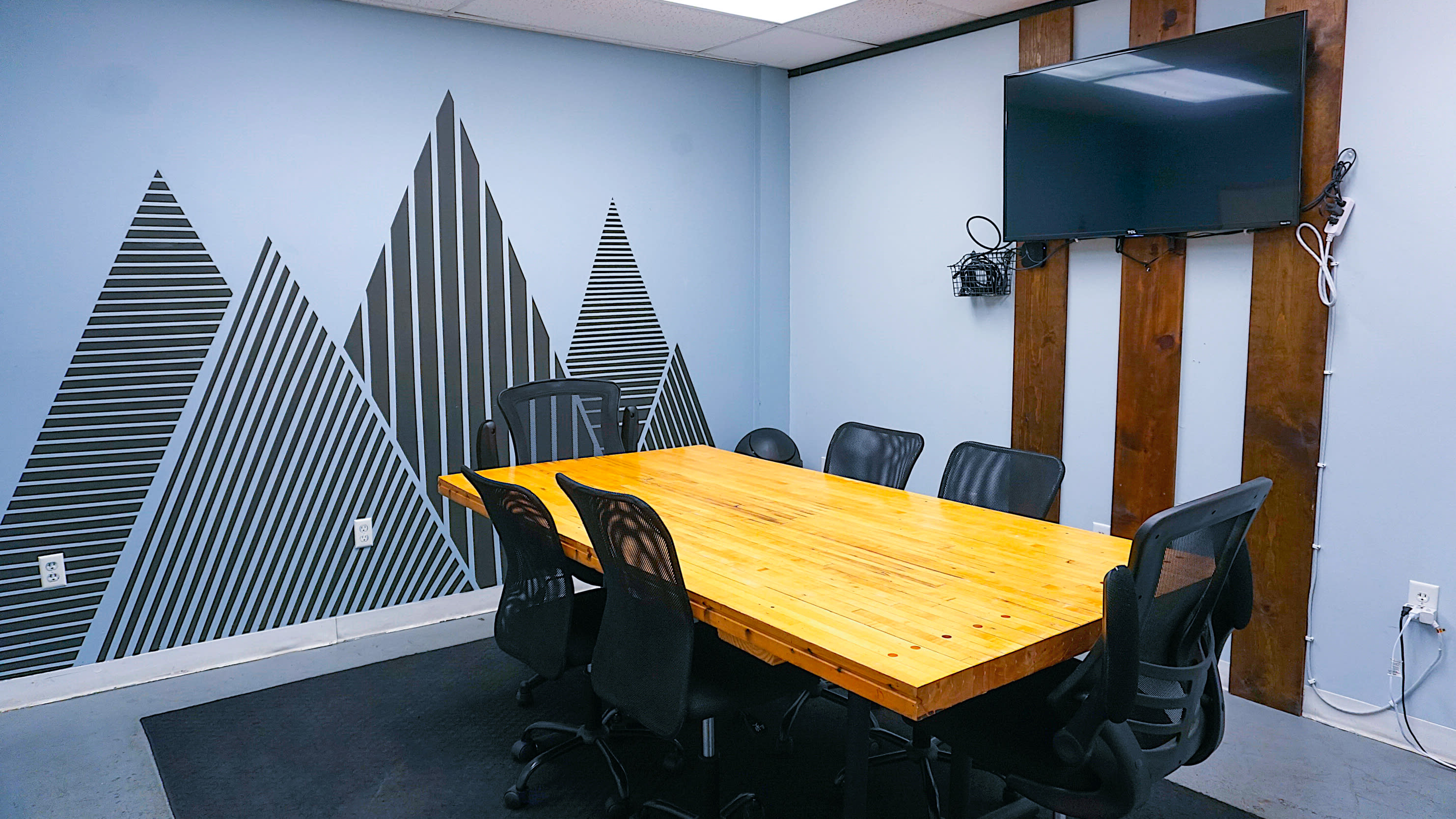 Small Conference Room With Whiteboard On Blue Wall Stock Photo