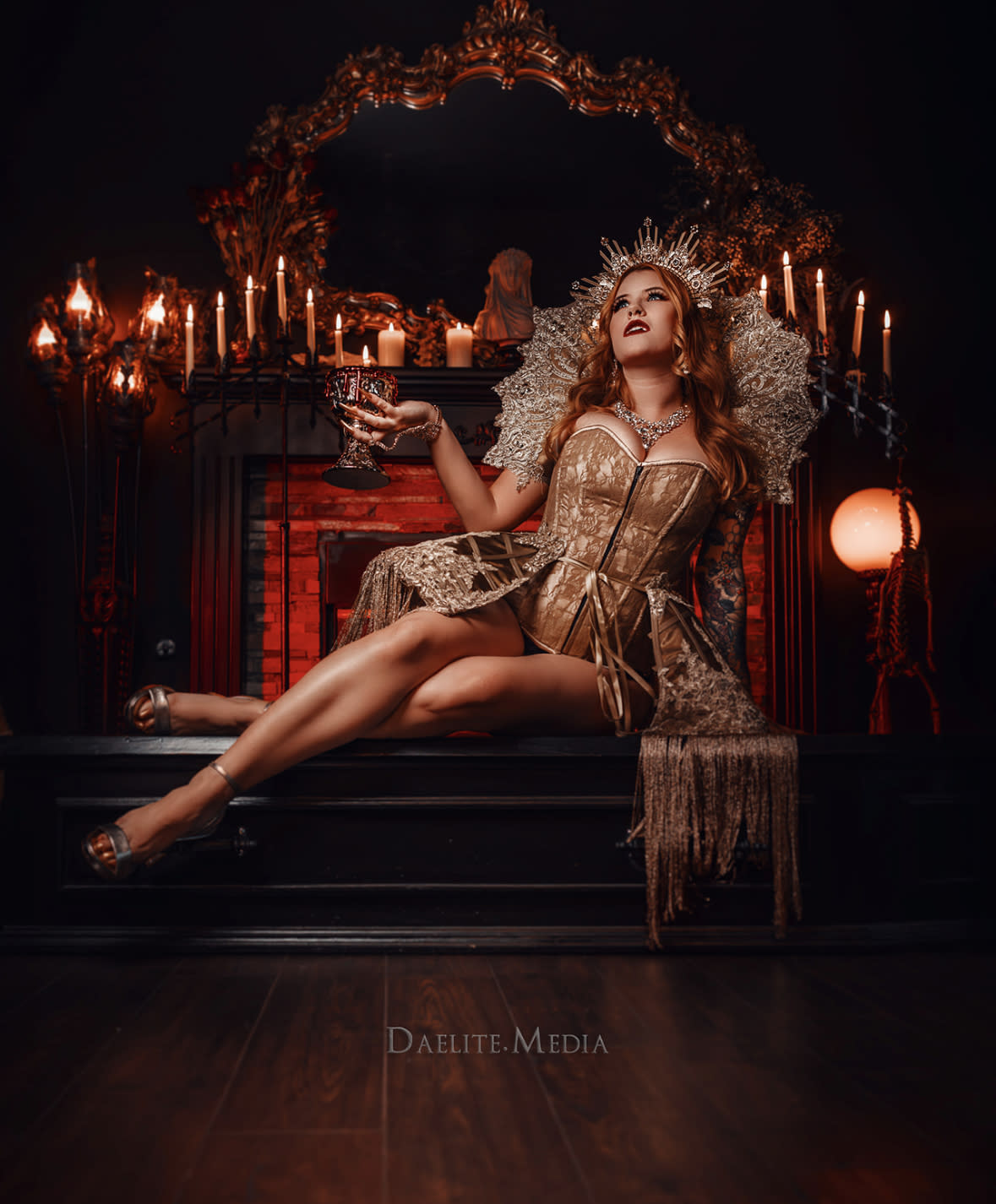 A model dressed in a gothic outfit poses dramatically in a dark setting, highlighting intricate details of her attire.