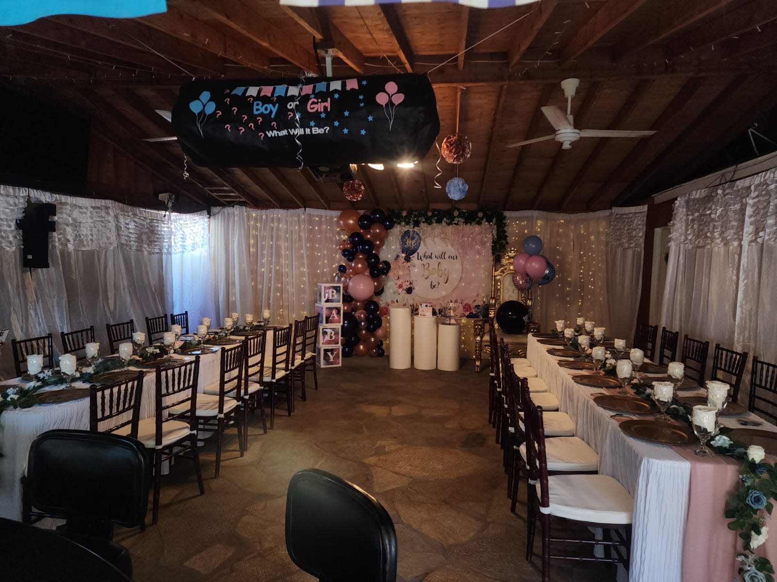 A colorful arch made of balloons welcomes guests to Jay's 1st birthday party, featuring a sign with the event details.