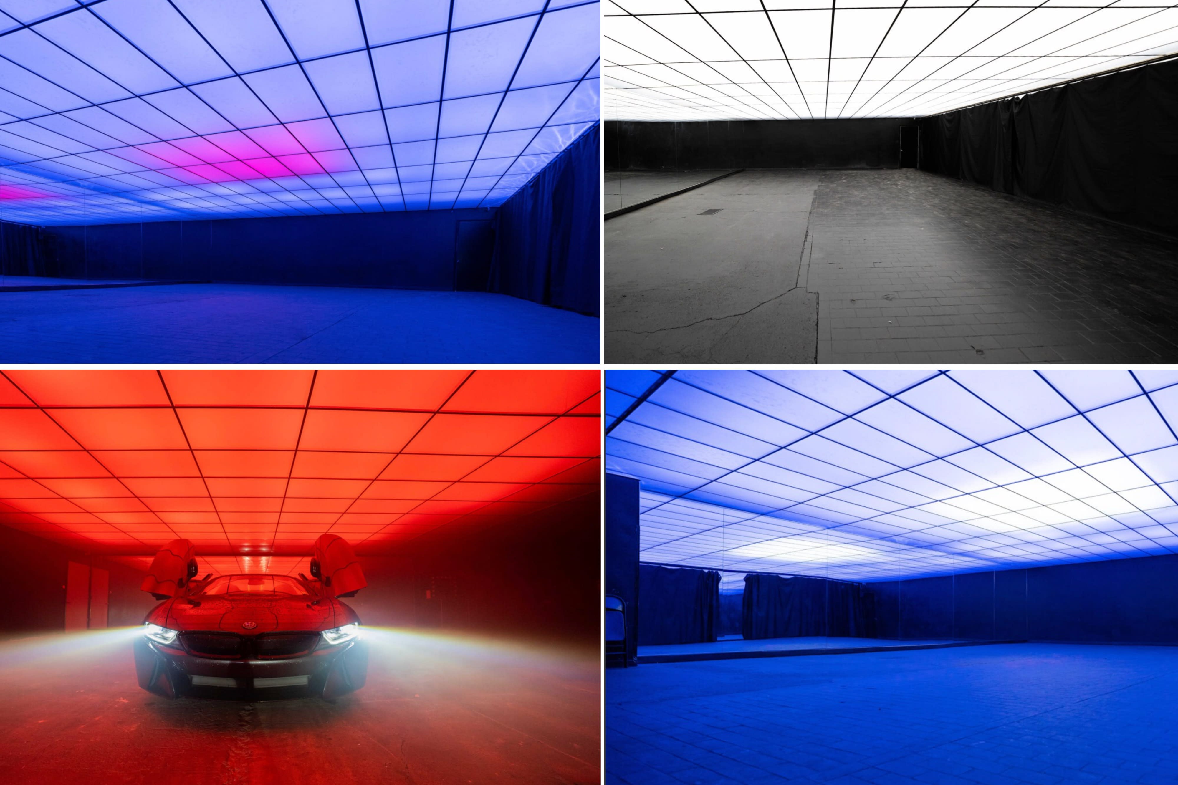 A person stands confidently next to a futuristic car in a mirrored studio space.