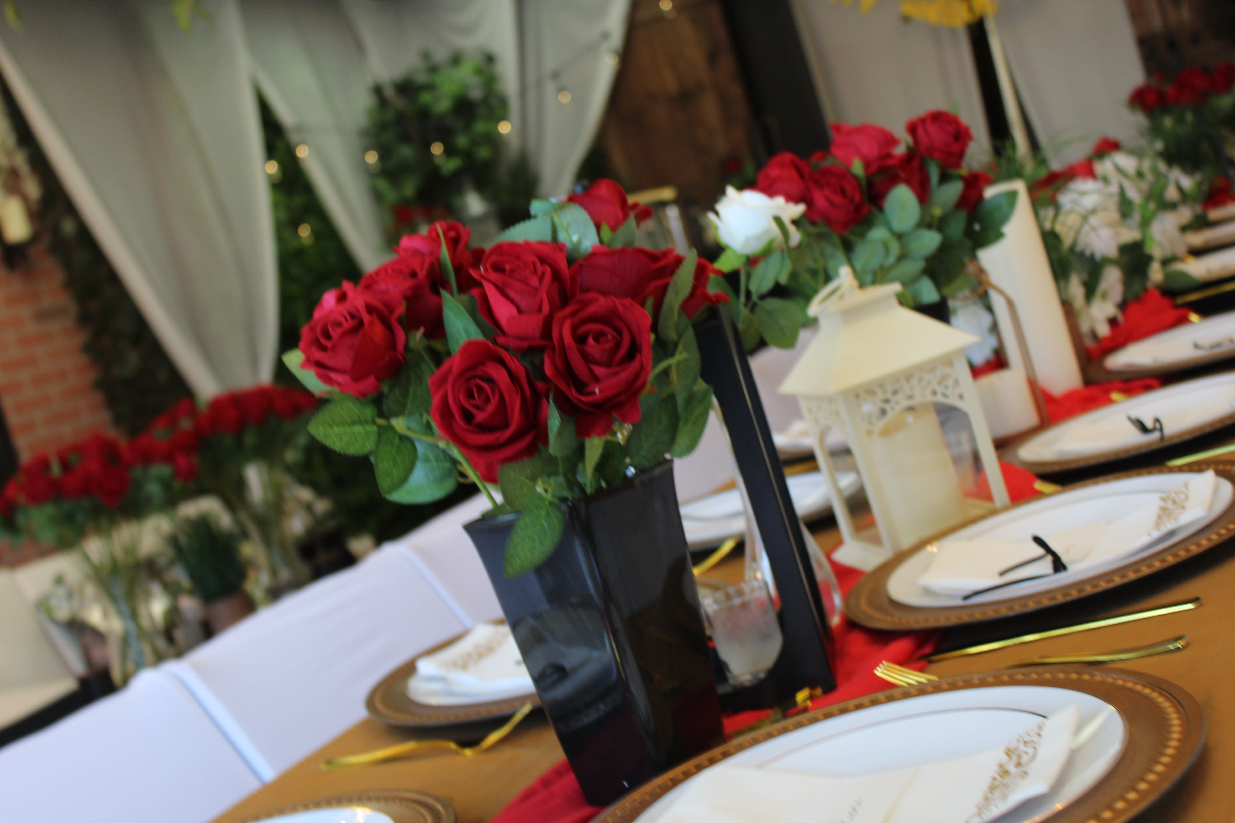 A group of people sits around a decorated table, enjoying food and celebrating at a birthday party.