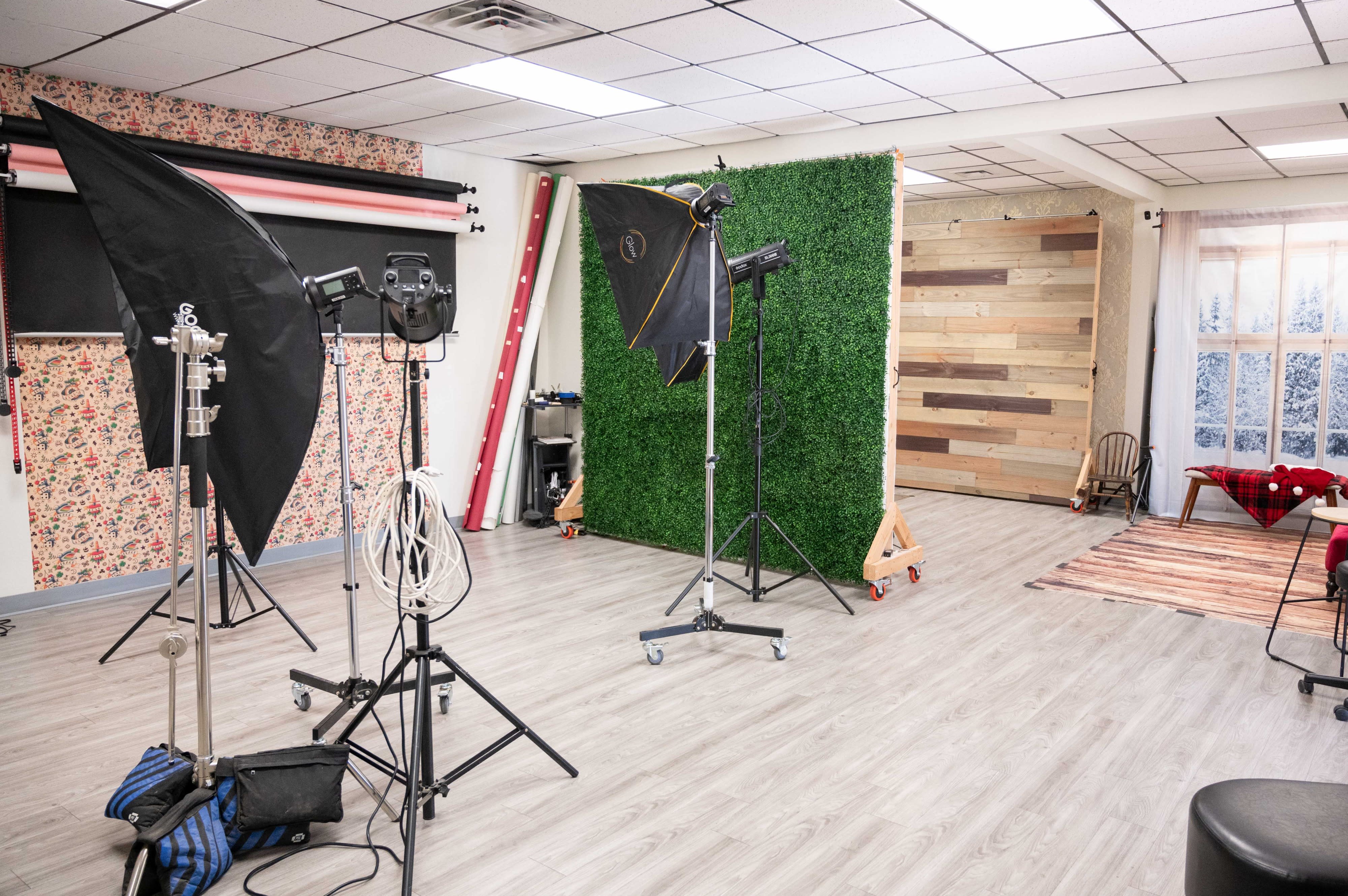 A camera captures a woman in a stylish outfit and high heels during a video shoot.