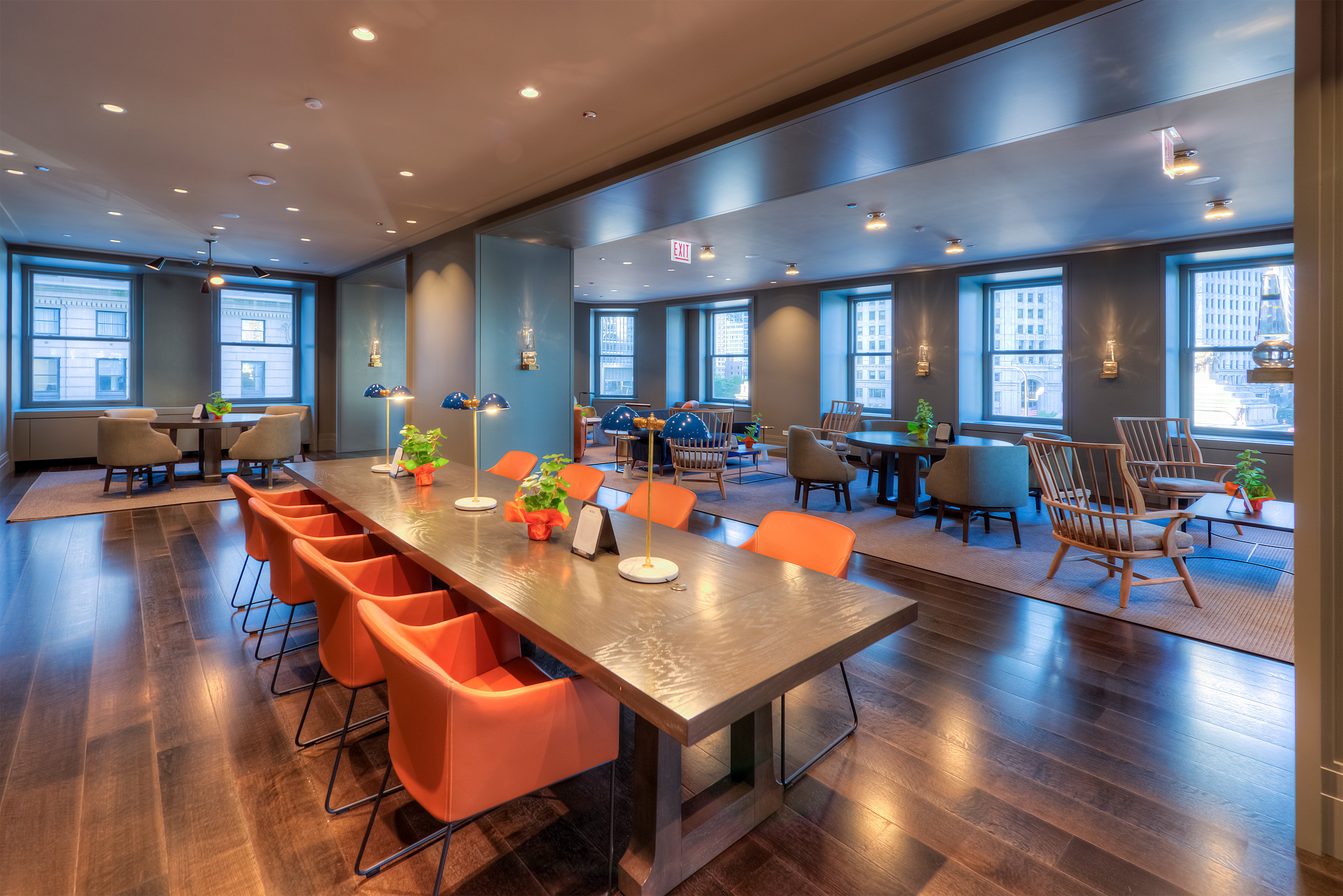 A cozy room with a mix of seating and a coffee table decorated with snacks and drinks, suitable for a birthday party gathering.