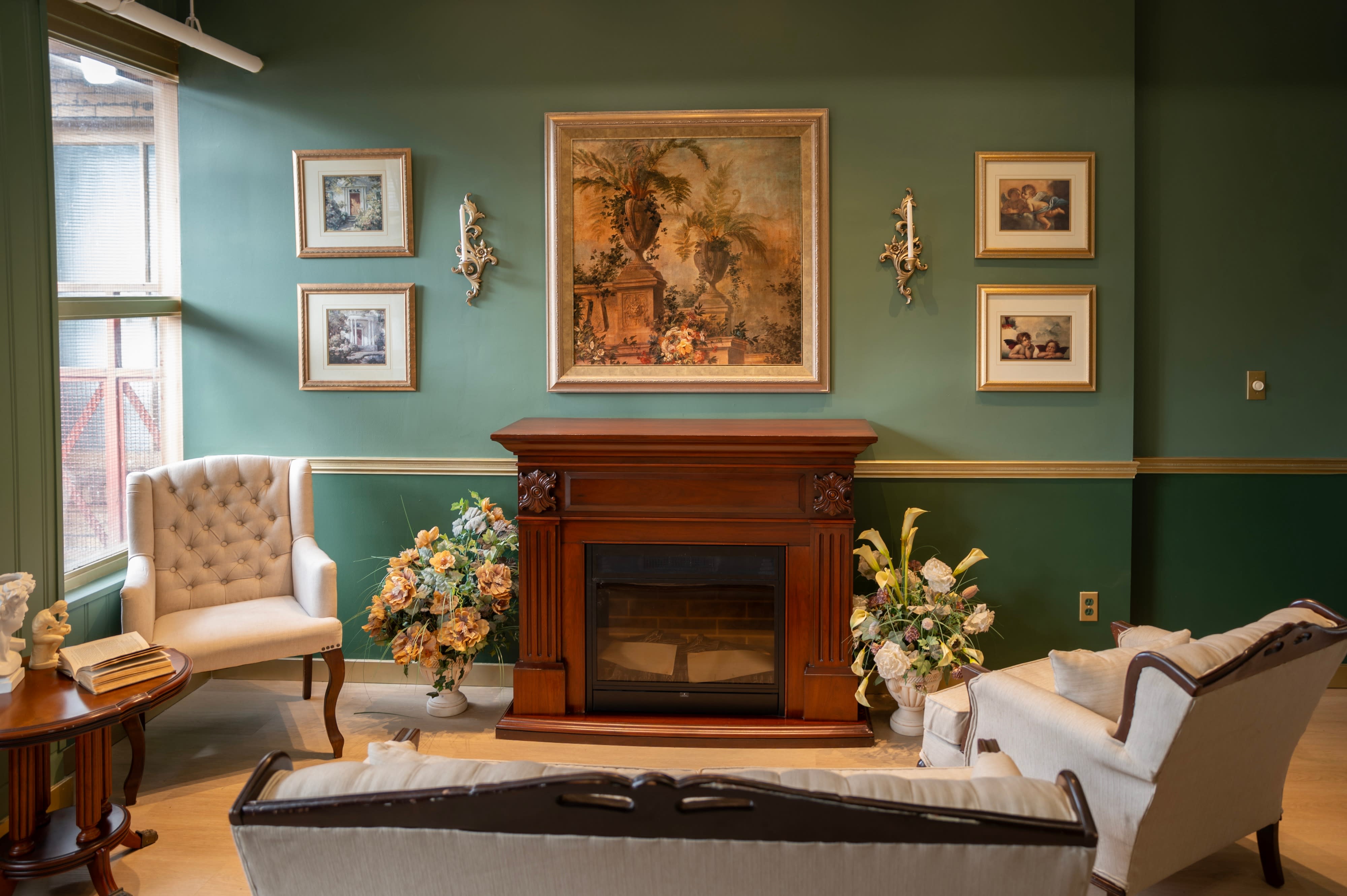 The photo shoot features a mother and her child posing together in a well-decorated living room with vintage furniture and artwork.