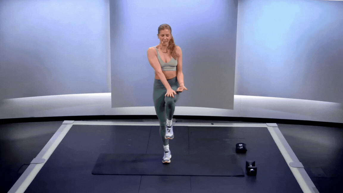 Peloton instructor Rebecca Kennedy demonstrates a single-leg balance isometric hold standing core exercise