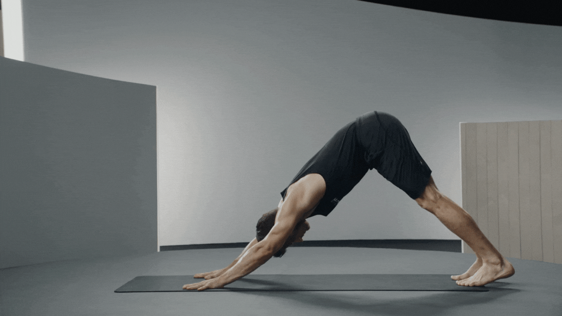 Peloton instructor Denis Morton demonstrates the steps of Upward-Facing Dog pose in yoga with proper form