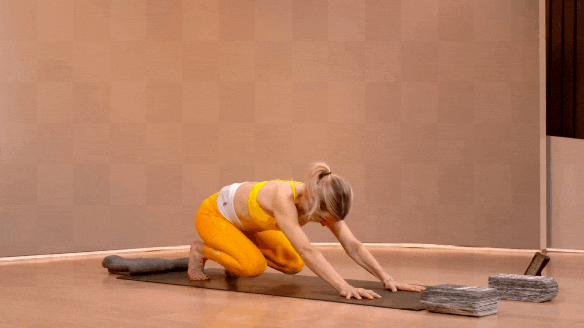 Two Women Standing In Warrior Pose On Yoga Mats by Stocksy