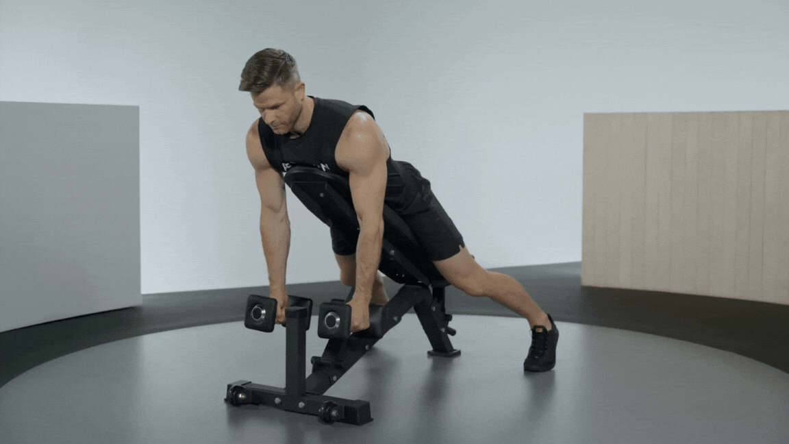 Peloton instructor Andy Speer demonstrates a chest-supported reverse fly rear deltoid exercise.