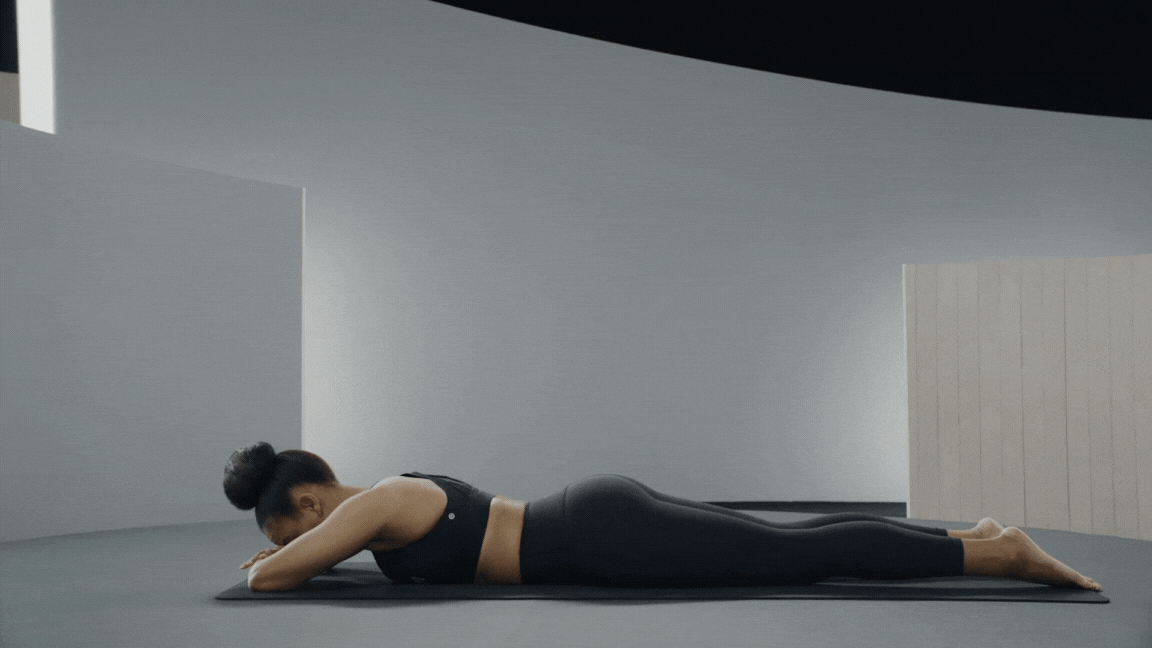 Peloton instructor Chelsea Jackson Roberts demonstrates Cobra Pose in yoga for core strength