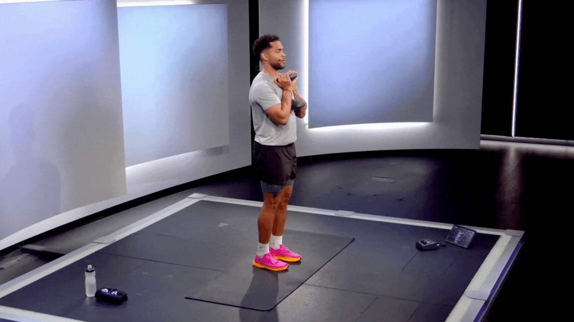 Peloton instructor Rad Lopez demonstrates a dumbbell calf raise in a lower legs strength class.