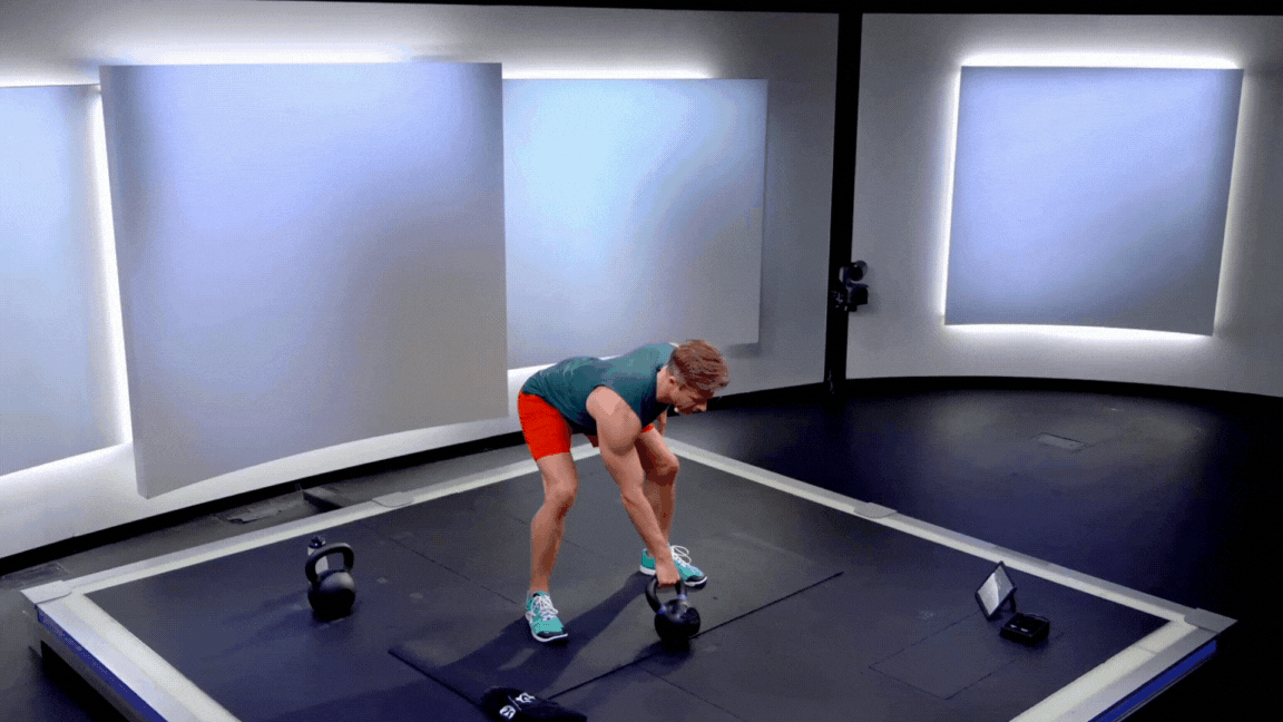Peloton instructor Andy Speer demonstrating a single rep of a kettlebell snatch