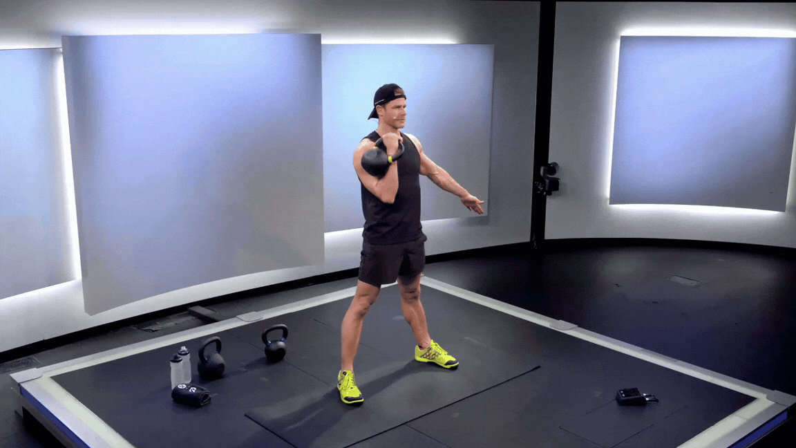 Peloton instructor Andy Speer demonstrates a kettlebell strict press as part of a list of kettlebell shoulder exercises