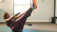 woman doing yoga at home