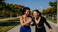 Two women exercising and laughing outside