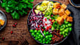 Vegan bowl with tofu, quinoa, vegetables and legumes