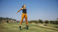 Woman jumping while exercising at outdoor park