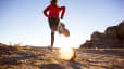 Woman trail running outdoors